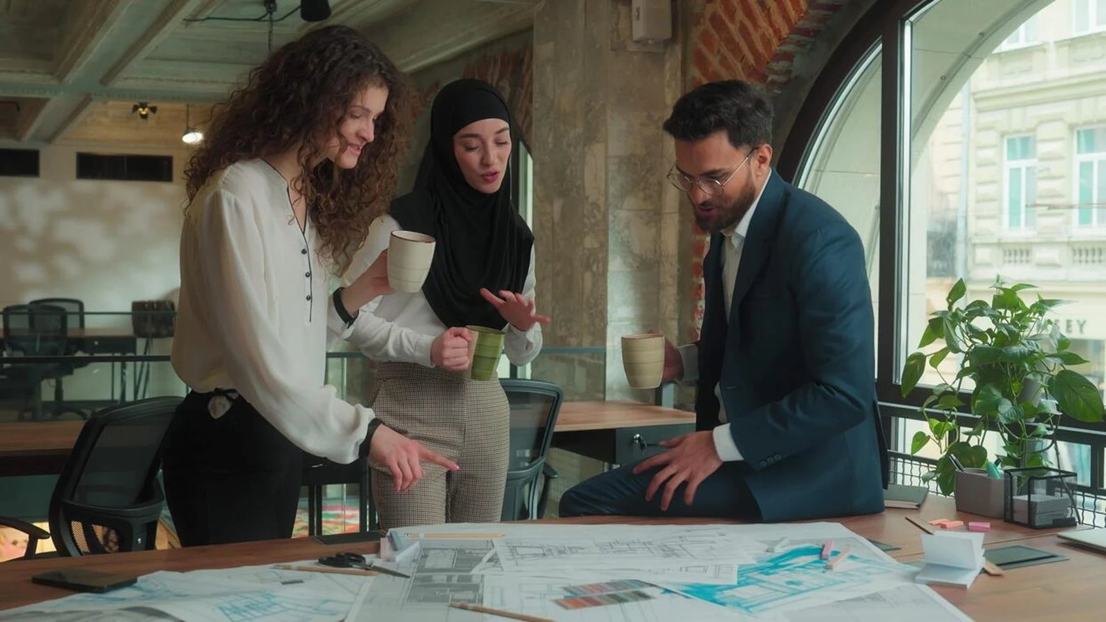 Advisory team discussing development plans around a table